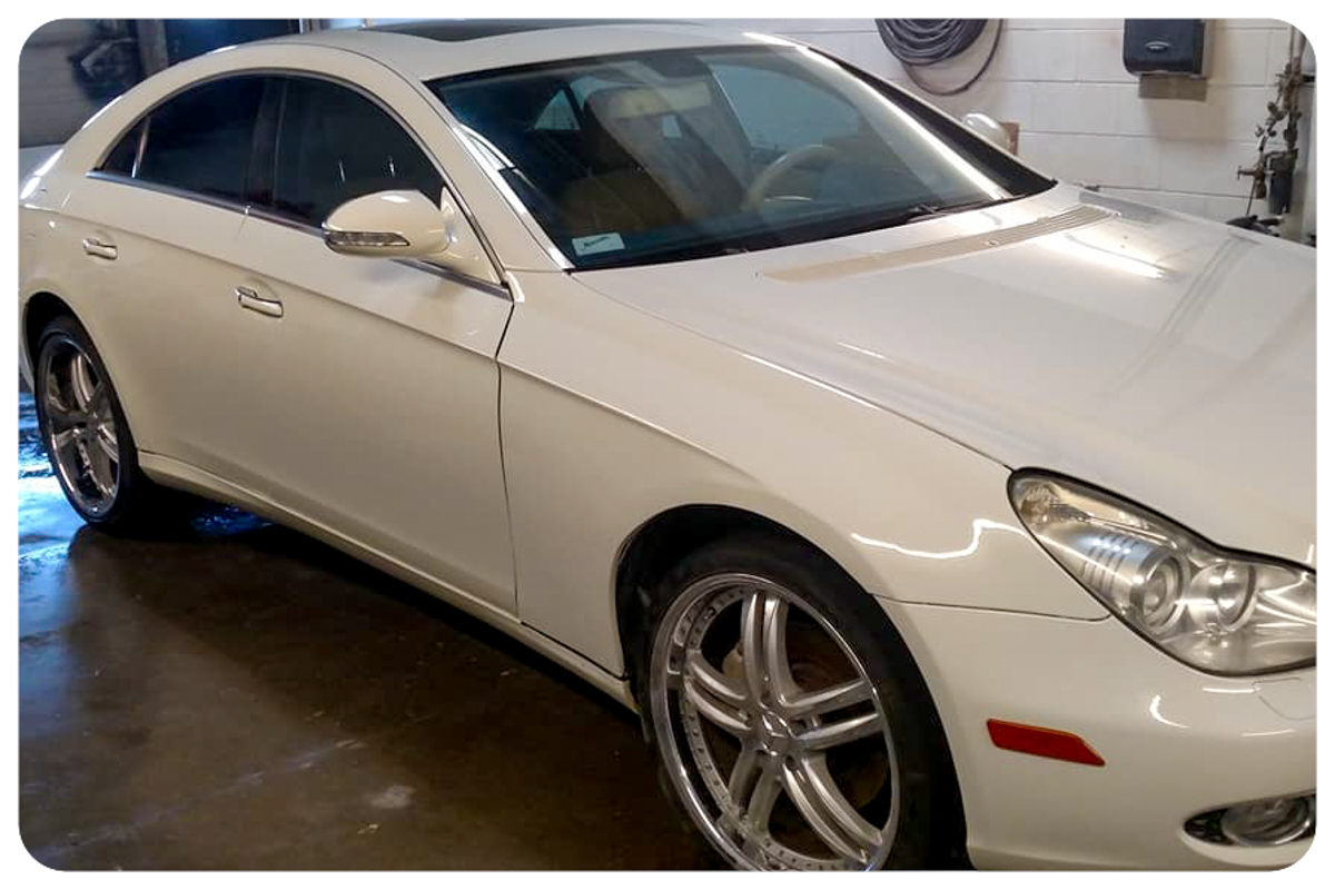 Mercedes-Benz CLS passenger side after pearl white repaint