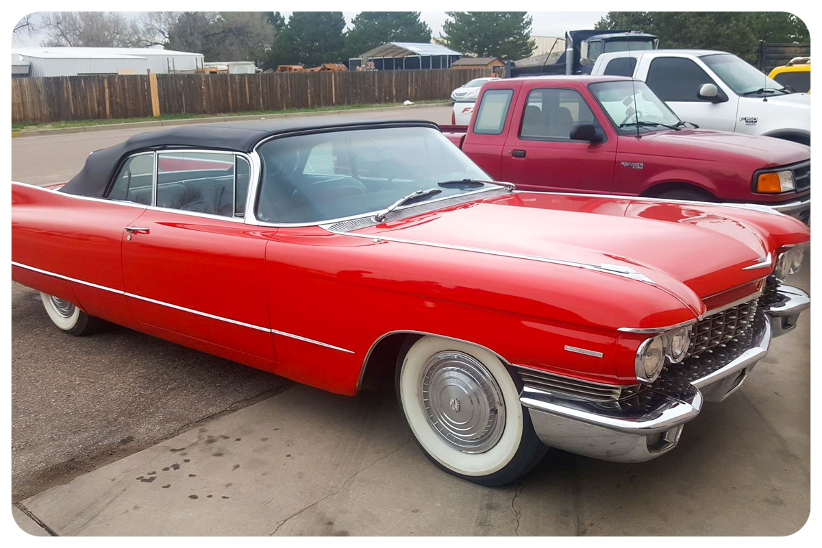 1962 Cadillac convertible side profile showing chrome and red paint