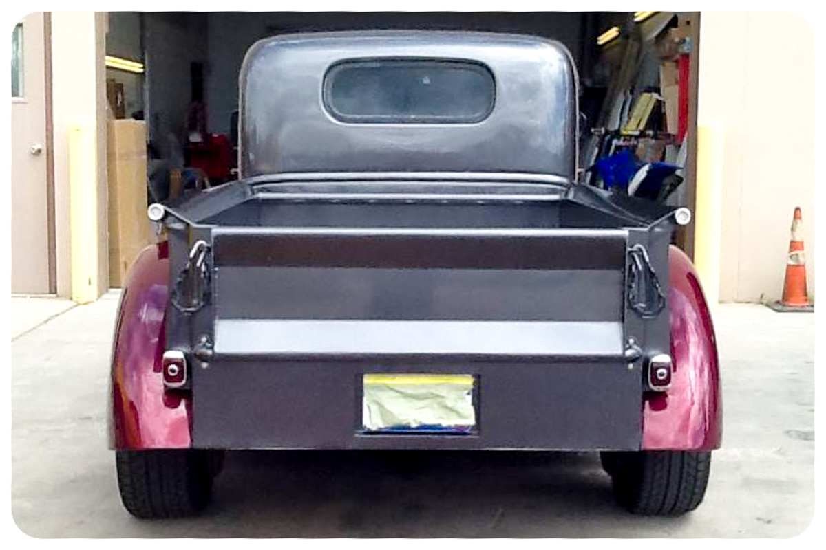 1941 Chevrolet pickup rear view showing custom bed and paint
