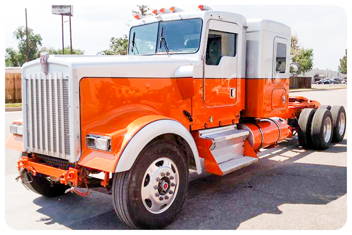 Peterbilt semi truck front quarter view in orange and silver
