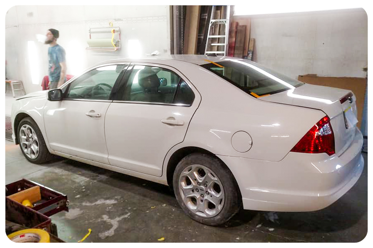 White Ford Fusion after collision repair and refinish