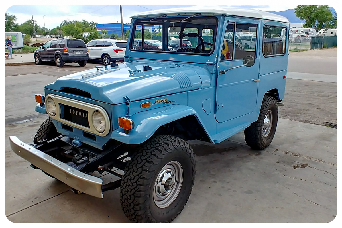 Toyota FJ40 Land Cruiser restored in sky blue with white top