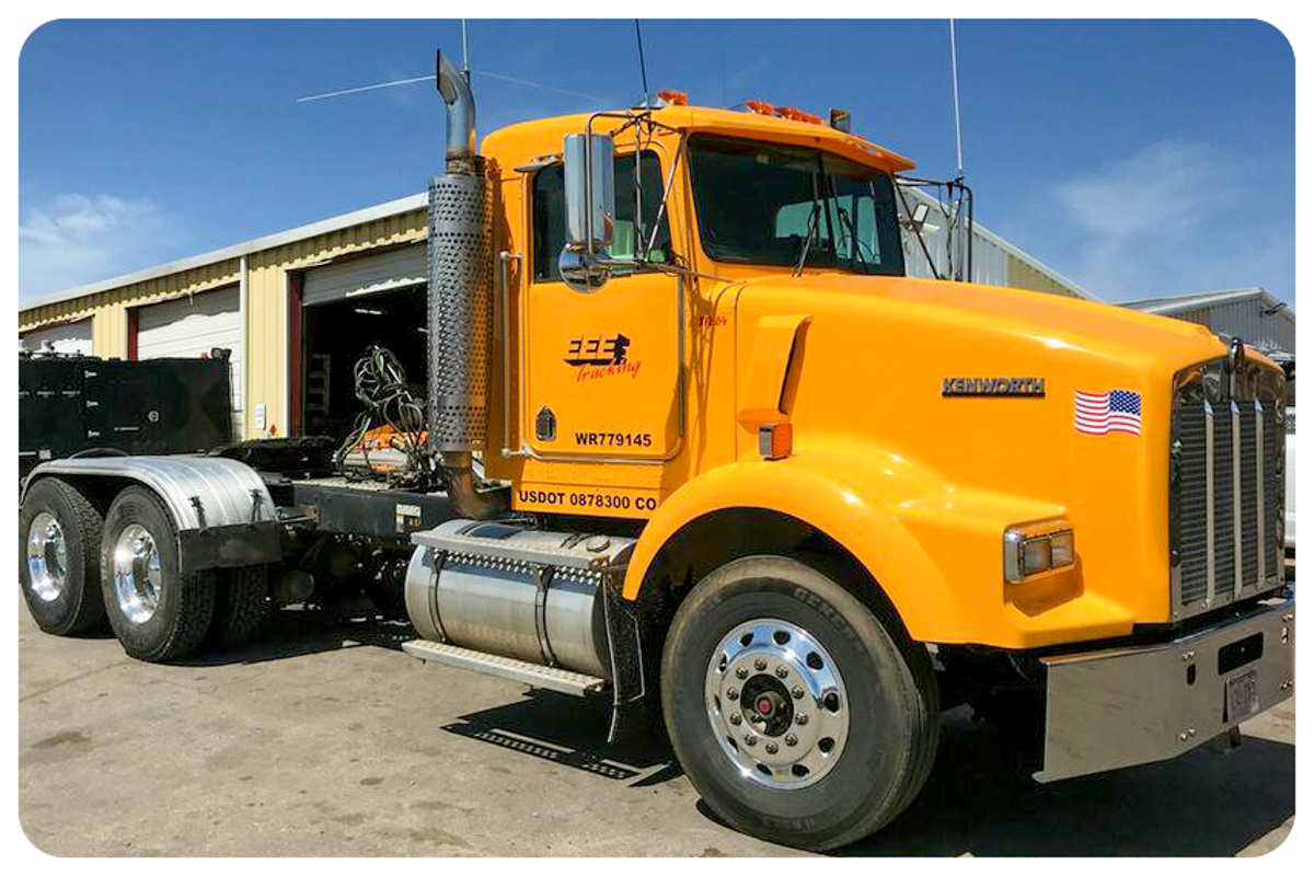 Yellow Kenworth T800 EEE Trucking side view with fleet markings